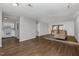 Open-concept living area featuring a step-up sitting area and a kitchen in the background at 635 Pine Ridge Pl, Raleigh, NC 27609