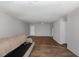 Living room with hard surface flooring, offering an open space with multiple entry points at 635 Pine Ridge Pl, Raleigh, NC 27609