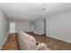 Open layout features a neutral-toned living area with hard surface flooring and modern lighting at 635 Pine Ridge Pl, Raleigh, NC 27609