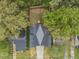 Aerial view of house, driveway, and backyard, surrounded by lush trees at 705 Colleton Rd, Raleigh, NC 27610
