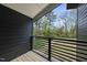 Private balcony overlooking backyard with treeline view at 705 Colleton Rd, Raleigh, NC 27610