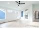 Bright bedroom with hardwood floors, large windows, and private balcony access at 705 Colleton Rd, Raleigh, NC 27610