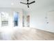 Bedroom with wood floors and private balcony access at 705 Colleton Rd, Raleigh, NC 27610