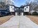 Modern duplex with two-car garage and landscaped yard at 705 Colleton Rd, Raleigh, NC 27610