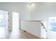 Bright hallway with light wood flooring and access to bedrooms at 705 Colleton Rd, Raleigh, NC 27610