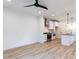 Modern kitchen features stainless steel appliances and light wood flooring at 705 Colleton Rd, Raleigh, NC 27610