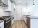 Modern kitchen with stainless steel appliances and an island at 705 Colleton Rd, Raleigh, NC 27610