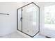 Large walk-in shower with glass enclosure and modern tile at 705 Colleton Rd, Raleigh, NC 27610