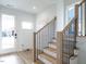 Modern staircase with light wood and black metal at 705 Colleton Rd, Raleigh, NC 27610