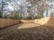 Spacious backyard enclosed by a wooden fence at 707 Colleton Rd, Raleigh, NC 27610