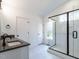 Modern bathroom with double vanity and large glass shower at 707 Colleton Rd, Raleigh, NC 27610