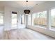 Bright dining room with hardwood floors and access to backyard at 707 Colleton Rd, Raleigh, NC 27610