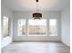 Bright dining room with hardwood floors and large windows at 707 Colleton Rd, Raleigh, NC 27610