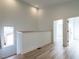 Light and bright hallway with wood floors at 707 Colleton Rd, Raleigh, NC 27610