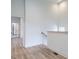 Light and bright hallway with wood floors at 707 Colleton Rd, Raleigh, NC 27610