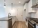 Modern kitchen with stainless steel appliances and white cabinetry at 707 Colleton Rd, Raleigh, NC 27610