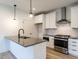 Modern kitchen with stainless steel appliances and a center island at 707 Colleton Rd, Raleigh, NC 27610
