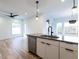Modern kitchen with stainless steel appliances and a large island at 707 Colleton Rd, Raleigh, NC 27610