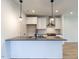 Modern kitchen featuring stainless steel appliances and white cabinetry at 707 Colleton Rd, Raleigh, NC 27610