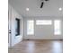Spacious main bedroom with wood floors and large windows at 707 Colleton Rd, Raleigh, NC 27610