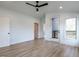 Spacious main bedroom with wood floors and access to balcony at 707 Colleton Rd, Raleigh, NC 27610