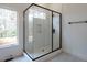 Large, updated shower with glass enclosure and modern tile at 707 Colleton Rd, Raleigh, NC 27610
