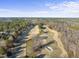 Aerial view of a golf course community with houses and green spaces at 7112 Hasentree Way, Wake Forest, NC 27587