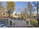 Stone patio with firepit and seating area, offering a relaxing outdoor space at 7112 Hasentree Way, Wake Forest, NC 27587