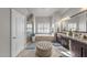 Luxurious bathroom with a soaking tub, vanity, and tiled floors at 7112 Hasentree Way, Wake Forest, NC 27587