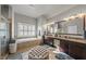 Elegant bathroom with double vanity, soaking tub, and walk-in shower at 7112 Hasentree Way, Wake Forest, NC 27587