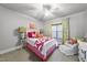 Charming bedroom with ceiling fan and stylish bedding at 7112 Hasentree Way, Wake Forest, NC 27587