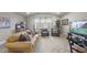 Spacious bonus room features comfortable seating and large TV at 7112 Hasentree Way, Wake Forest, NC 27587