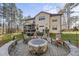 Two-story house with screened porch and deck, situated in wooded area at 7112 Hasentree Way, Wake Forest, NC 27587