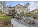 Two-story house with screened porch and deck, situated in wooded area at 7112 Hasentree Way, Wake Forest, NC 27587