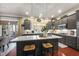 Island kitchen with stainless steel appliances and ample counter space at 7112 Hasentree Way, Wake Forest, NC 27587