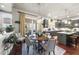 Spacious kitchen with island, stainless steel appliances, and dark gray cabinets at 7112 Hasentree Way, Wake Forest, NC 27587