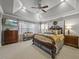 Spacious main bedroom with a king-size bed and a ceiling fan at 7112 Hasentree Way, Wake Forest, NC 27587