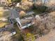 Aerial view of property showing a well-maintained home with a private backyard deck and driveway at 8 Kingston Mill Ct, Durham, NC 27701