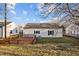 Backyard view of home, showing a deck, lawn, and exterior siding at 8 Kingston Mill Ct, Durham, NC 27701