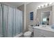 Bathroom featuring a shower/tub combo and a pristine white single sink vanity at 8 Kingston Mill Ct, Durham, NC 27701