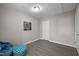 A cozy bedroom features modern gray flooring and an artistic Eiffel Tower wall decoration at 8 Kingston Mill Ct, Durham, NC 27701
