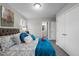 Bright bedroom featuring an en-suite bathroom and lots of natural light from the window at 8 Kingston Mill Ct, Durham, NC 27701