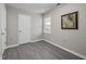 A well-lit bedroom with wood-look flooring and a classic wall art piece at 8 Kingston Mill Ct, Durham, NC 27701