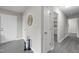 Hallway features fresh paint, wood-look floors, and access to multiple rooms at 8 Kingston Mill Ct, Durham, NC 27701
