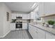 Kitchen features stainless steel appliances, granite countertops, and white shaker cabinets at 8 Kingston Mill Ct, Durham, NC 27701