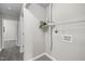Functional laundry area with fresh paint, a convenient shelf, and ample space at 8 Kingston Mill Ct, Durham, NC 27701