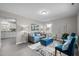 Inviting living room with modern decor, complemented by soothing blue accents and ample natural light at 8 Kingston Mill Ct, Durham, NC 27701