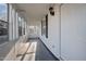 Enclosed porch with a door and several windows, creating a versatile space at 8 Kingston Mill Ct, Durham, NC 27701