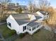 Exterior showcasing home's roofline and fencing, highlighting backyard privacy and architectural details at 8 Kingston Mill Ct, Durham, NC 27701
