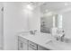Bathroom with dual sinks, vanity and framed mirror and walk-in shower at 804 Heathered Farm Way, Apex, NC 27523